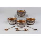 A set of four early 20th century French silver salts of lobed oval form, each cast with stems of