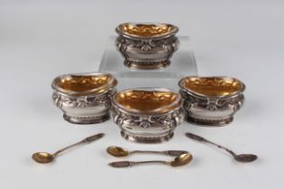 A set of four early 20th century French silver salts of lobed oval form, each cast with stems of