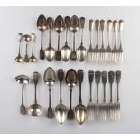 An early 19th century harlequin part canteen of silver Fiddle pattern cutlery, comprising four