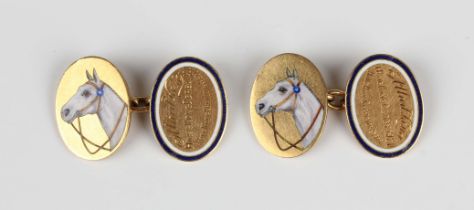 A pair of gold and enamelled oval cufflinks, one side depicting the head of a white horse, the other