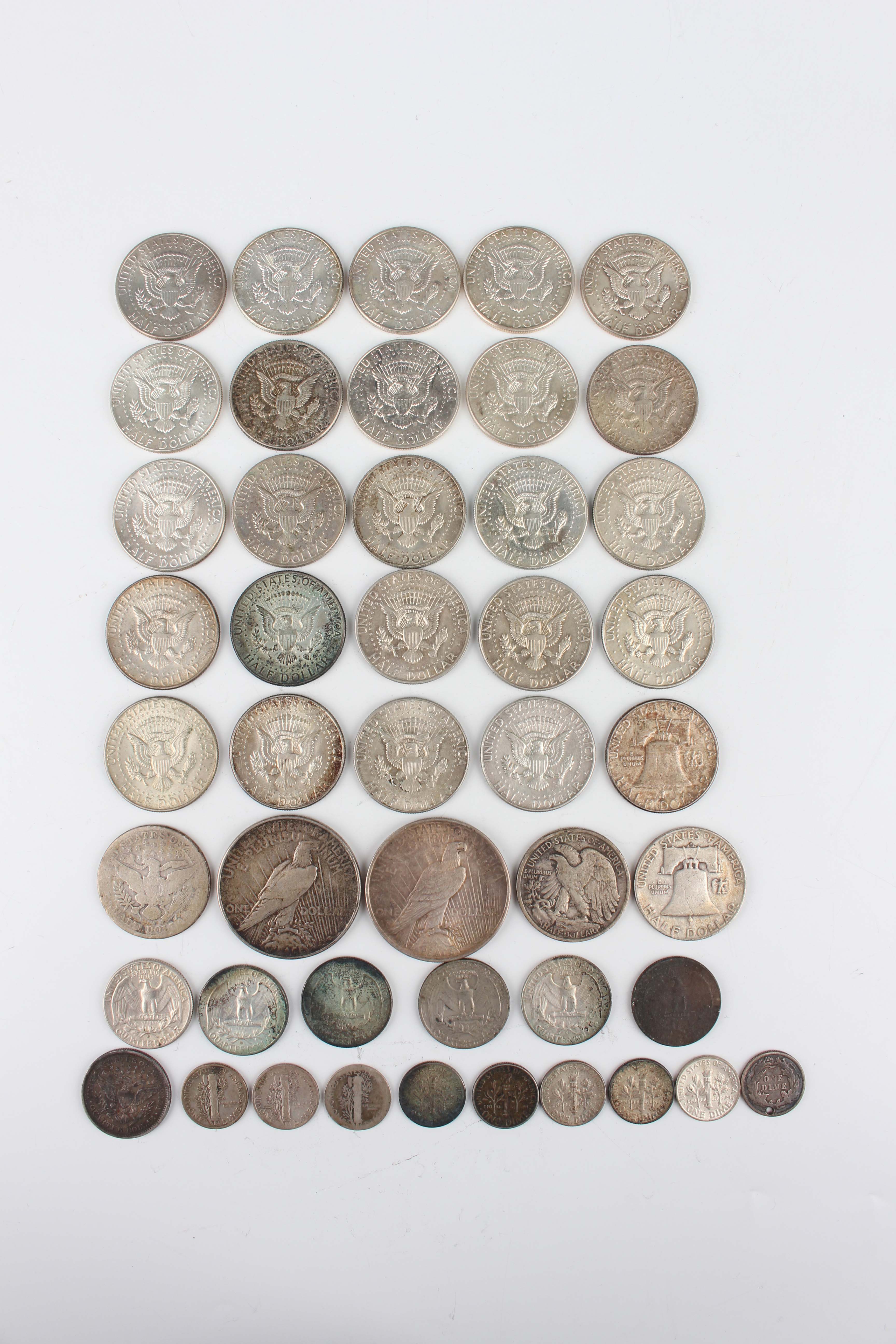 A collection of USA silver coinage, including two one dollars, 1922 and 1924, three half-dollars, - Image 2 of 2