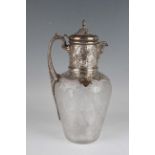 A late Victorian silver mounted Stourbridge intaglio cut glass claret jug, the domed hinged lid with