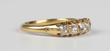A gold and diamond five stone ring, mounted with a row of cushion cut diamonds, unmarked, weight 3.