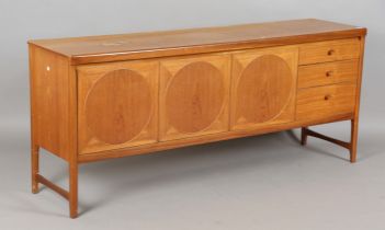 A mid-20th century teak 'Circles' sideboard by Nathan Furniture, fitted with three circular panelled
