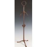 An Arts and Crafts wrought iron fire tool stand, attributed to Norman Bucknell for Ernest Gimson,