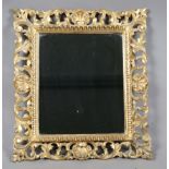 An early 20th century Florentine giltwood wall mirror with foliate scrolling frame, 45cm x 40cm (