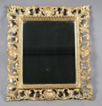 An early 20th century Florentine giltwood wall mirror with foliate scrolling frame, 45cm x 40cm (