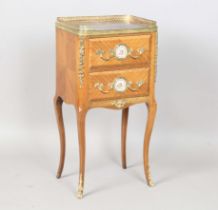 An early 20th century French walnut and gilt metal mounted two drawer chest, inset with two