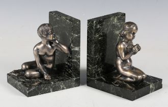 Henri Fugère - a pair of early 20th century French silvered cast bronze and green marble figural