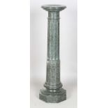 A Victorian carved green serpentine sectional display pedestal, the stop fluted stem above an