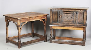 A 17th century and later oak centre table with shaped corner brackets and carved legs, height