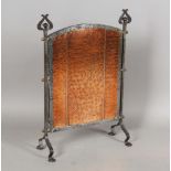 An early 20th century Arts and Crafts copper and wrought iron firescreen with overall hammered