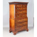 A good George III mahogany chest-on-chest, the blind fretwork frieze above an arrangement of oak-