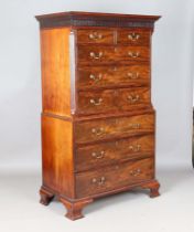 A good George III mahogany chest-on-chest, the blind fretwork frieze above an arrangement of oak-