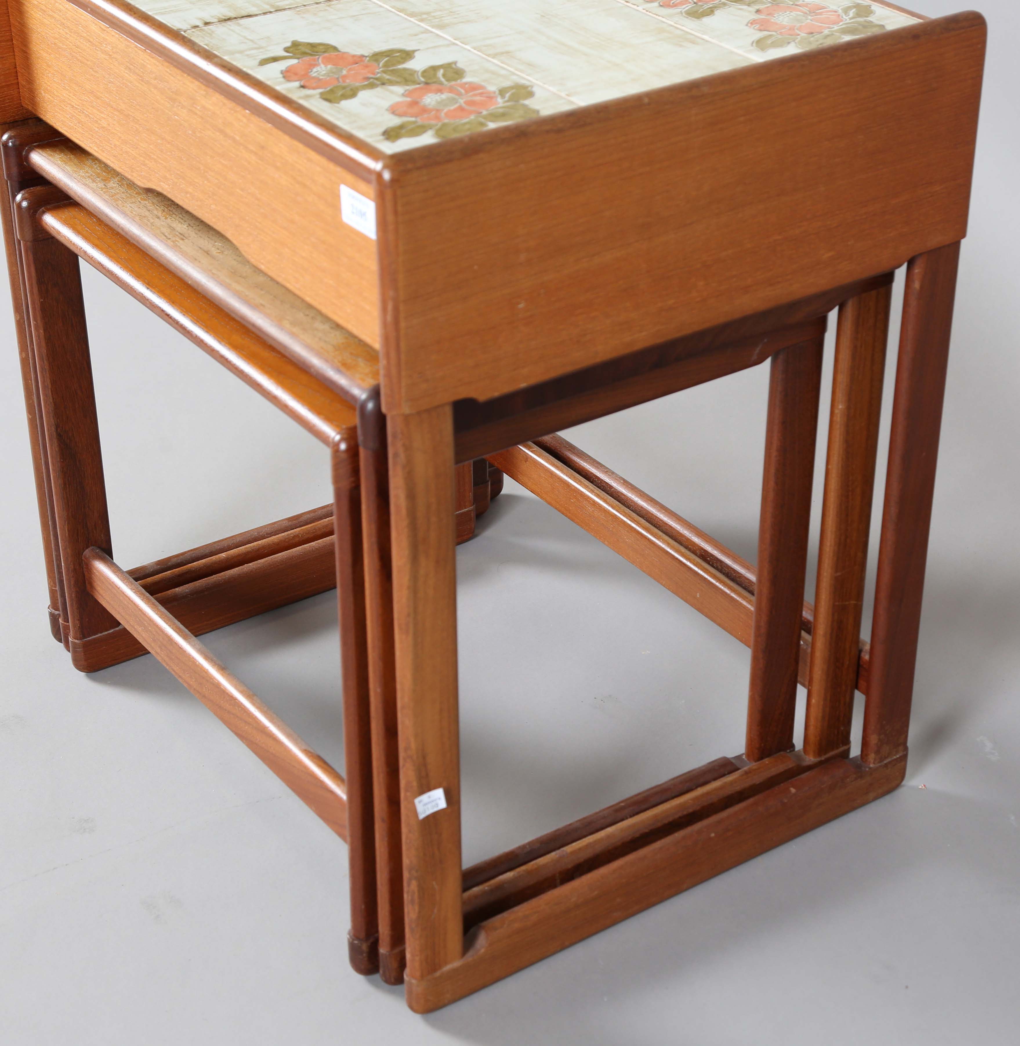 A mid-20th century G-Plan teak nest of three occasional tables, the top table fitted with a tiled - Image 2 of 6