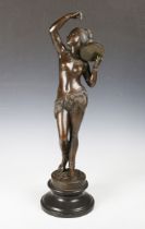 A large modern brown patinated cast bronze figure of a tambourine dancer, bearing cast signature '