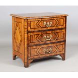 An 18th century Continental walnut and rosewood crossbanded three-drawer chest of small proportions,