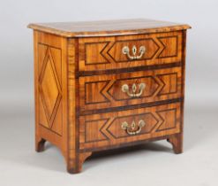 An 18th century Continental walnut and rosewood crossbanded three-drawer chest of small proportions,