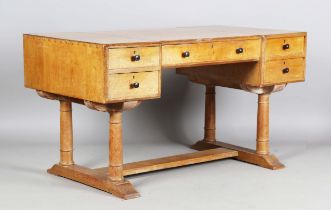 An early 20th century Heals Arts and Crafts oak dressing table, probably designed by Ambrose Heal,