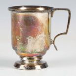 An Arts and Crafts silver christening tankard of cylindrical form, engraved with a band of upright