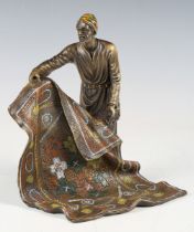 A modern Franz Bergmann style cold painted bronze figure of a carpet seller, height 20cm.Buyer’s