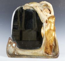 An Austrian Art Nouveau painted and gilt decorated terracotta dressing table mirror, the frame