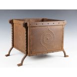A late Victorian Aesthetic Movement wrought iron and tin log box, in the manner of Christopher