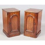 A pair of Victorian mahogany bedside cabinets, one fitted with interior sliding trays, height