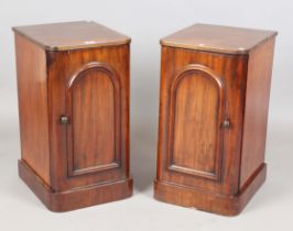 A pair of Victorian mahogany bedside cabinets, one fitted with interior sliding trays, height