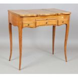 A 20th century French walnut poudreuse dressing table, fitted with three hinged lids above two