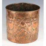 An early 20th century Arts and Crafts Newlyn copper cylindrical planter with riveted seams,