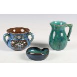 Three pieces of art pottery, late 19th/early 20th century, comprising a Della Robbia jug with