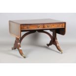 An early 20th century George III style mahogany sofa table with satinwood crossbanding and downswept