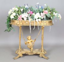 A Victorian giltwood and gesso planter, the curve-ended trough fitted with a tin liner, the base