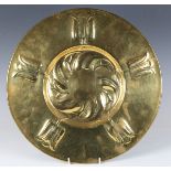 An Edwardian Arts and Crafts brass circular charger, in the manner of Liberty & Co, the decorated