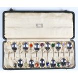 A set of eleven Arts and Crafts silver coffee spoons with hardstone terminals, Birmingham 1924 and