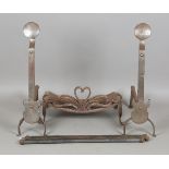 A pair of large early 20th century Arts and Crafts steel fire andirons, in the manner of Ernest