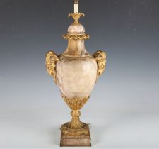 An early 20th century Neoclassical Revival marble and ormolu mounted table lamp with twin ram's head