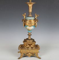 A late 19th century gilt metal table lamp with inset Sèvres style painted porcelain panels and