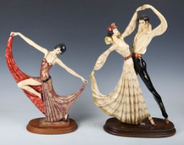 A modern polychrome painted composite figure depicting an Art Deco female dancer on a wooden oval