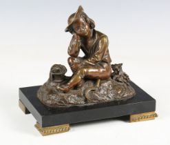 A late 19th century French brown patinated bronze model of a snoozing grape harvester, on a