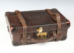 An early 20th century heavy leather cartridge case, the lid embossed 'R.J.F', fitted with brass