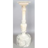 A substantial late 19th century alabaster pedestal with a flower cusp carved stem above a deep