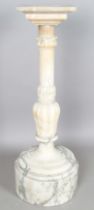 A substantial late 19th century alabaster pedestal with a flower cusp carved stem above a deep