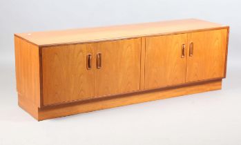 A mid-20th century G-Plan teak low sideboard, fitted with four doors, height 53cm, width 162cm,