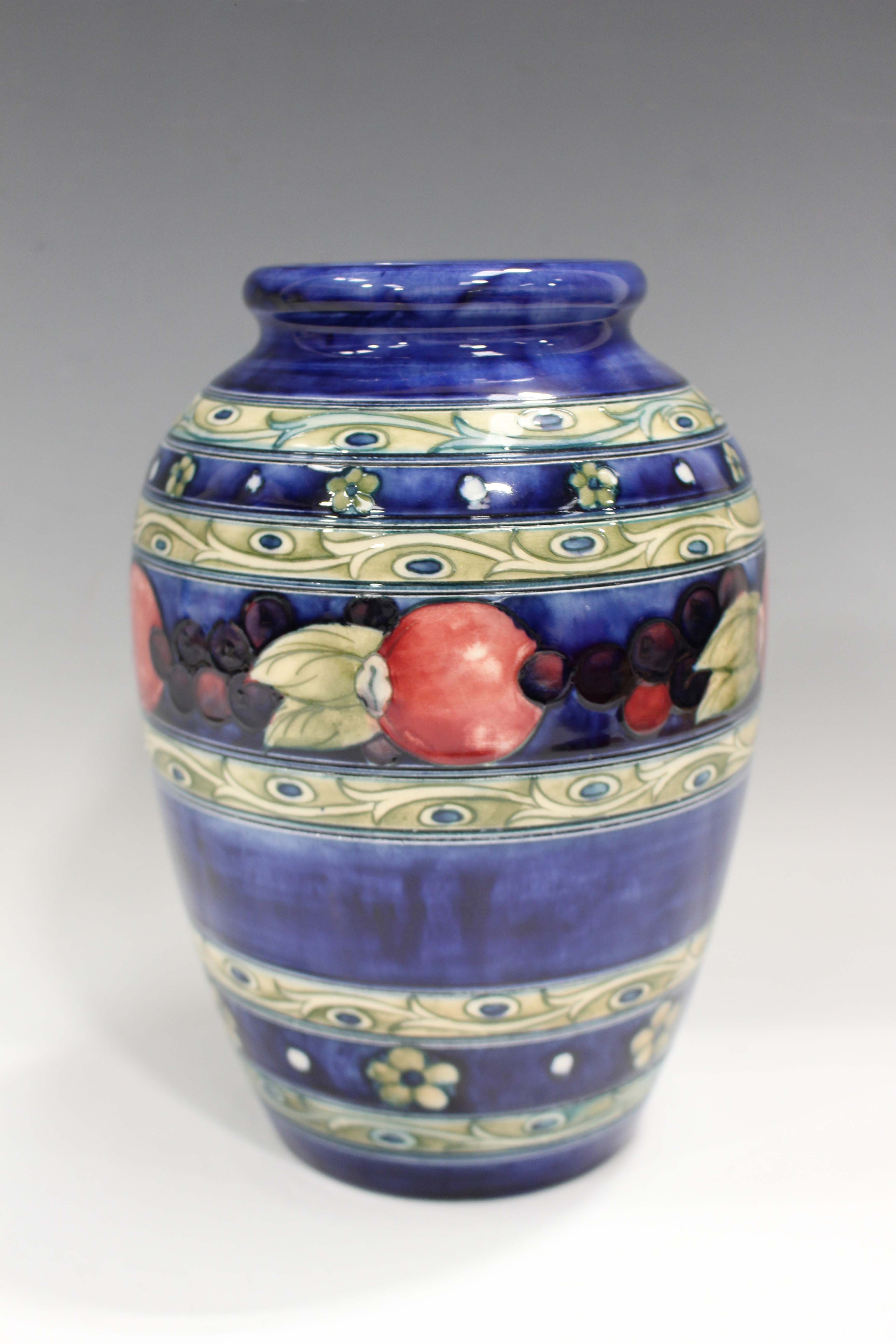 A Moorcroft Banded Pomegranate pattern vase, 1930s, impressed marks and painted signature to base,