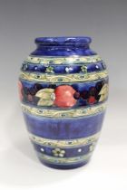 A Moorcroft Banded Pomegranate pattern vase, 1930s, impressed marks and painted signature to base,