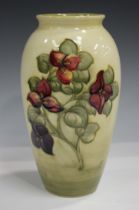 A Moorcroft Bougainvillea pattern vase, mid-20th century, with shaded pale green ground, impressed