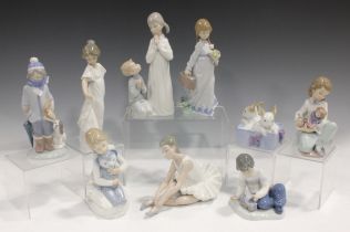 Four Lladro figures, comprising Thoughtful Caress, No. 5990, Winter, No. 5220, Teaching To Pray, No.