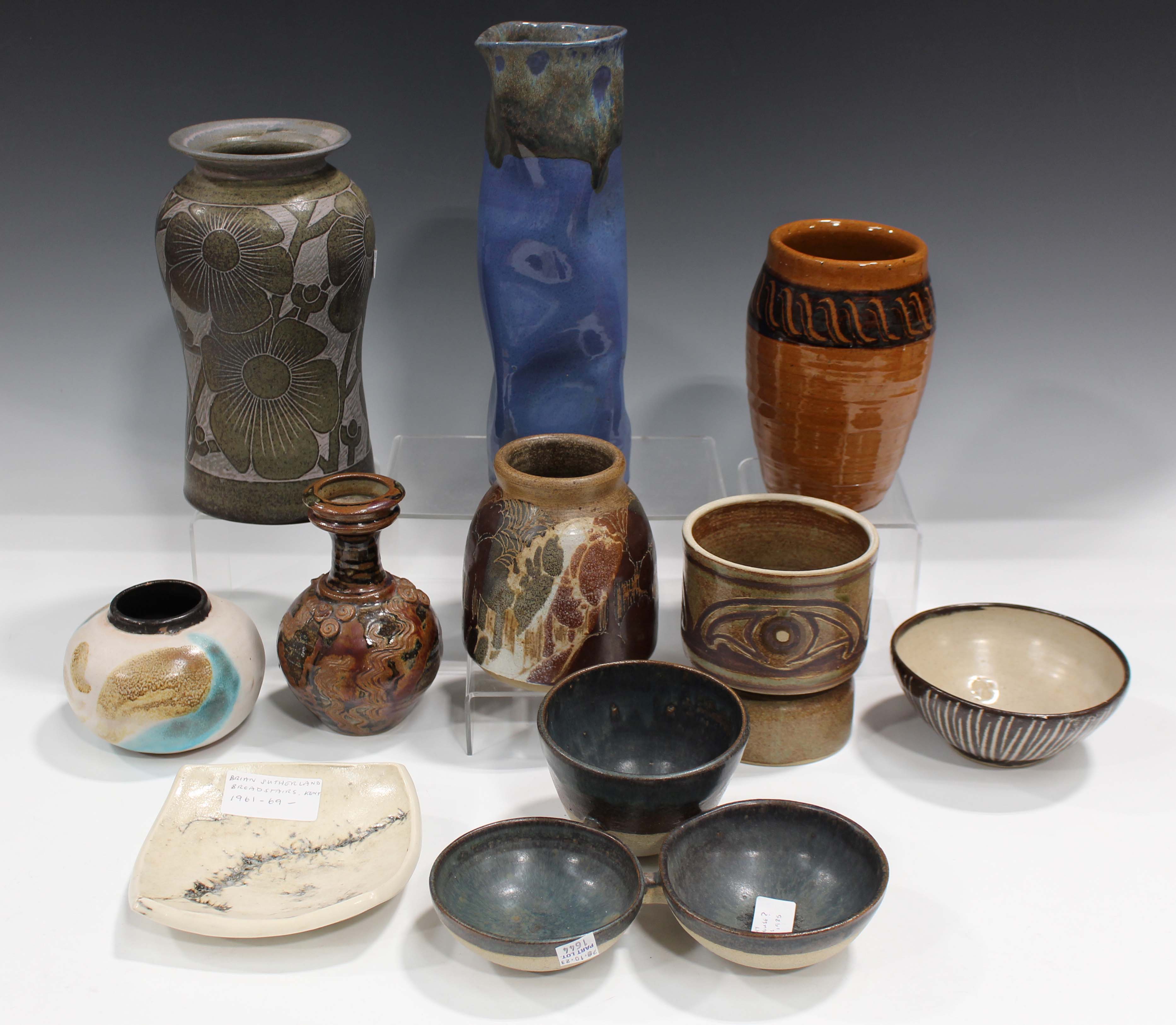 A collection of studio pottery, including a Michael Leach for Yelland Pottery bowl with striped